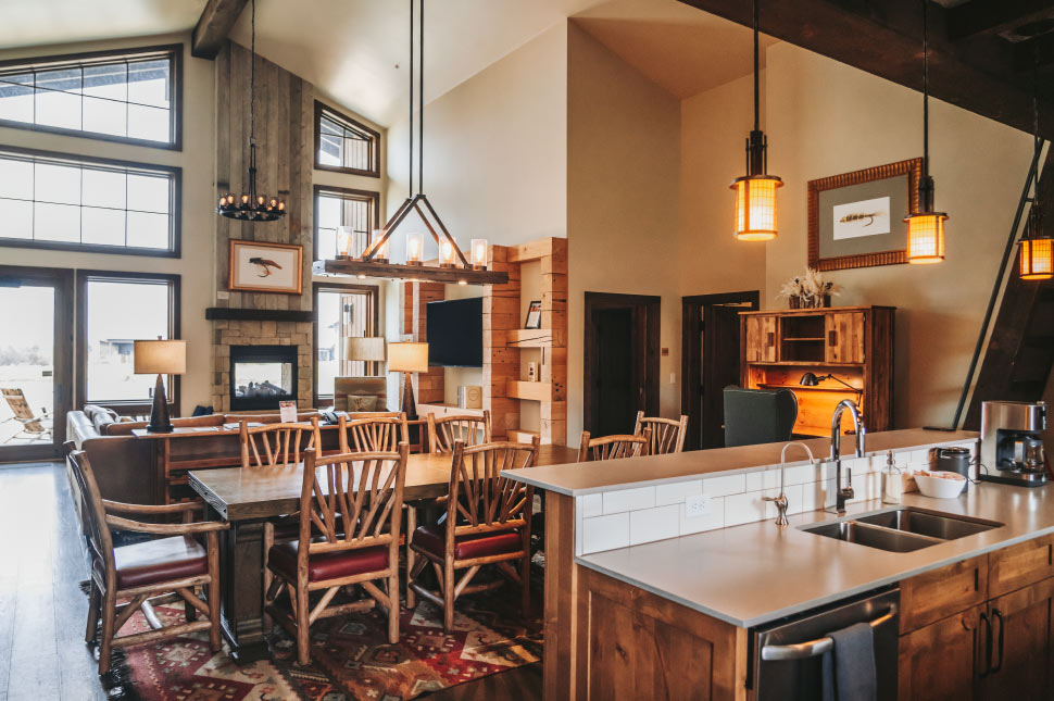 https://sagelodge.com/wp-content/uploads/2022/11/970x645-ranch-house-kitchen-and-living-room-at-Sage-Lodge-Montana-Luxury-lodging-near-Yellowstone.jpg