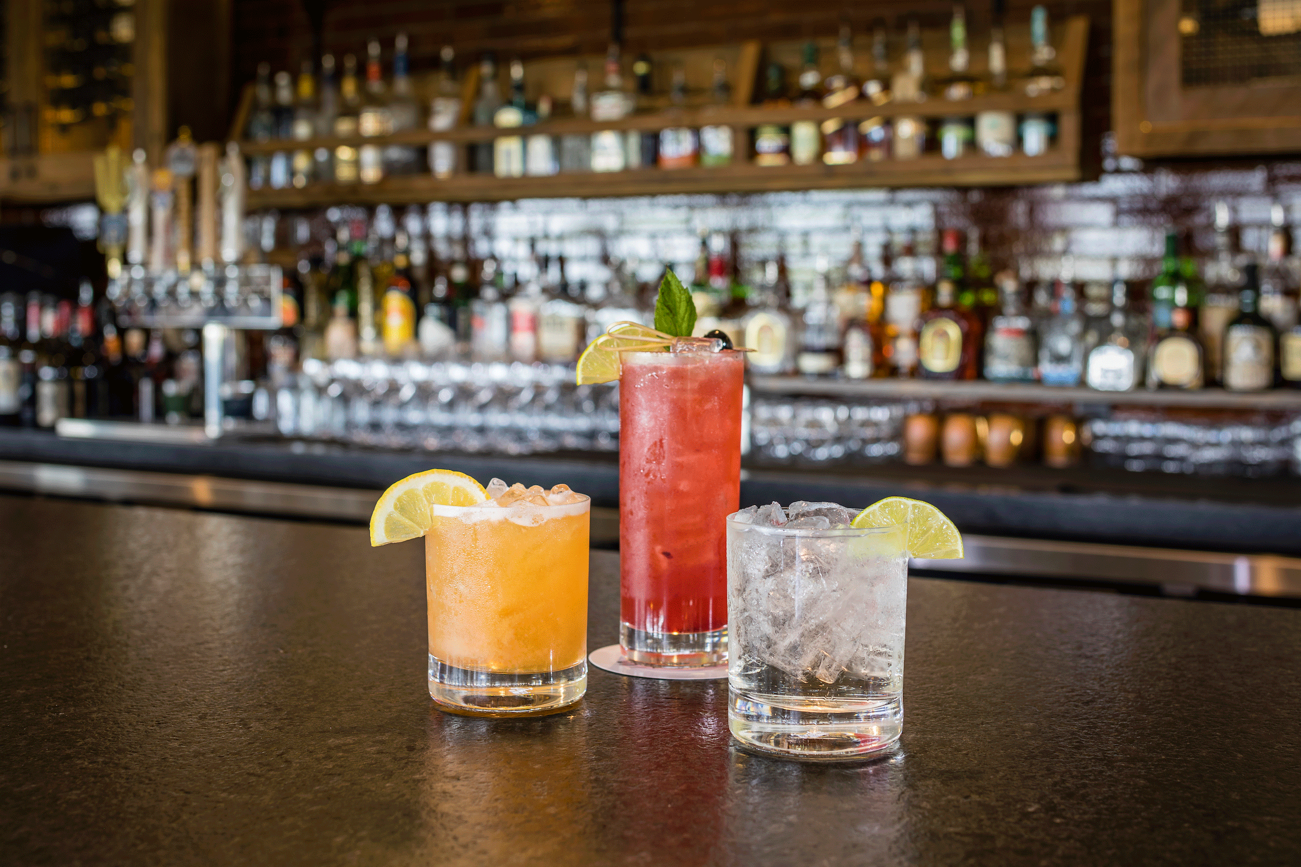 three cocktails on bar