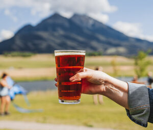 A pint of beer with Emigrant Peak in the background.