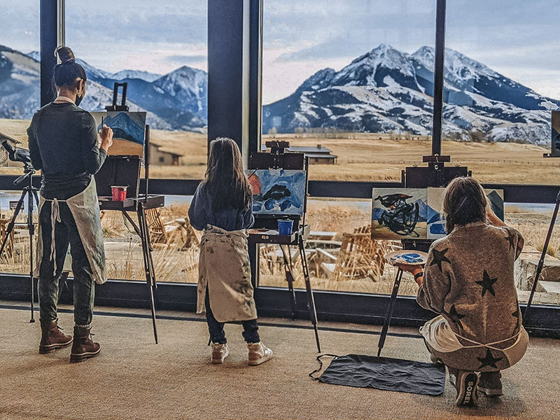 A family enjoying painting indoors