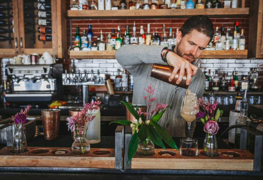 Bartender making a cocktail.