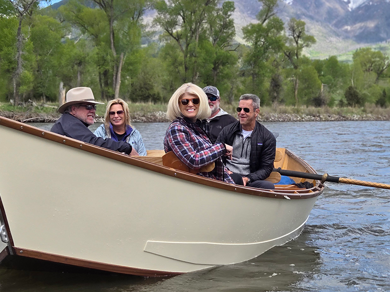 Group of people enjoying a scenic float on the Yellowstone River.