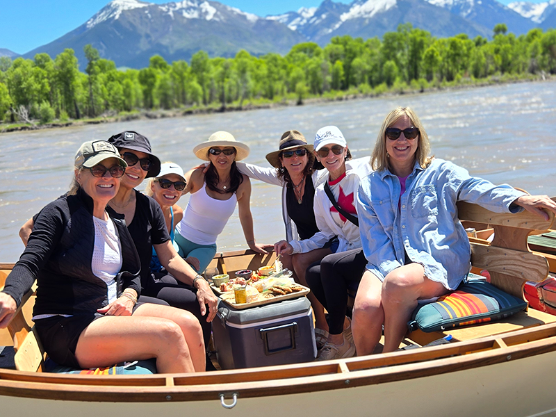 Group of people enjoying a scenic float on the Yellowstone River.