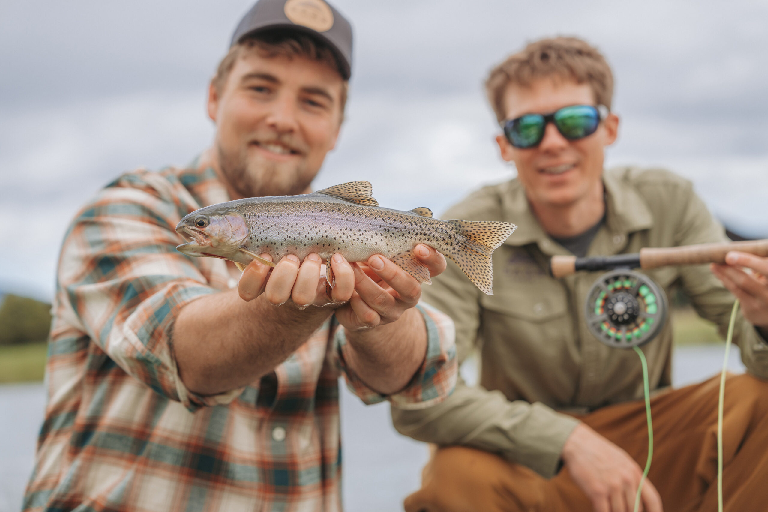 Fishing Guide and Guest holding a fish.
